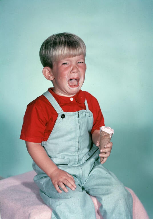 Boy Crying With Ice Cream Cone