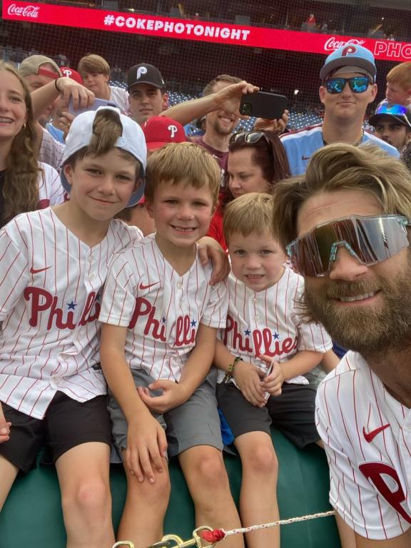 Bryce Harper with the family he helped reunite at batting practice