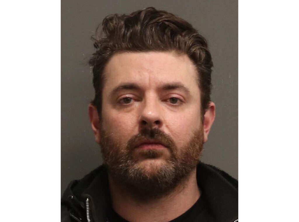 Chris Young Orange t-shirt - Chris Young's actually mugshot him wearing a black t-shirt. 