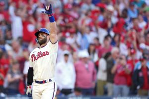 Bryce Harper #3 of the Philadelphia Phillies celebrates a home run against the Atlanta Braves