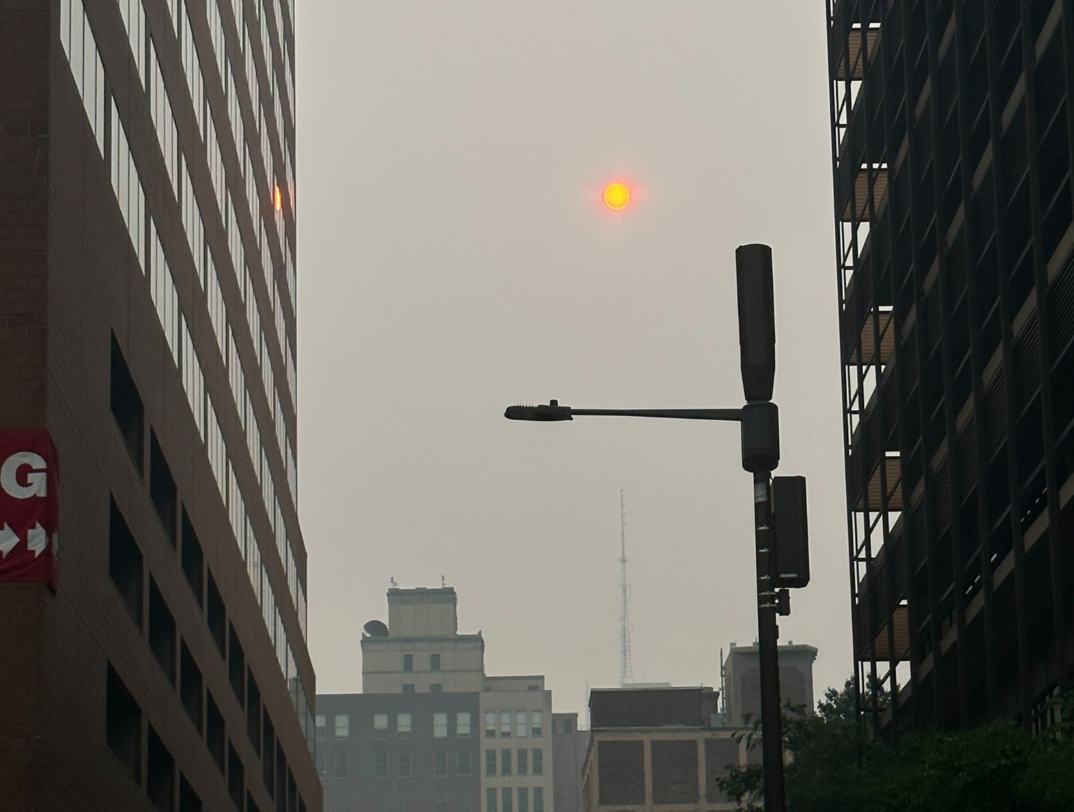 Canadian Wildfire Smoke is still here, and the sun is orange through the plumes of smoke