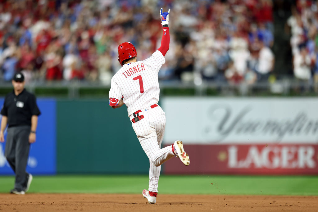 Edmundo Sosa #33 of the Philadelphia Phillies reacts after hitting a solo  home run during the eighth inning.