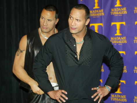 403707 01: Professional wrestler Dwayne "The Rock" Johnson poses at the unveiling of his wax portrait at Madame Tussaud's Wax Museum April 10, 2002 in New York City. The museum creates life-size, three-dimensional wax sculptures of celebrities and historical figures around the world.