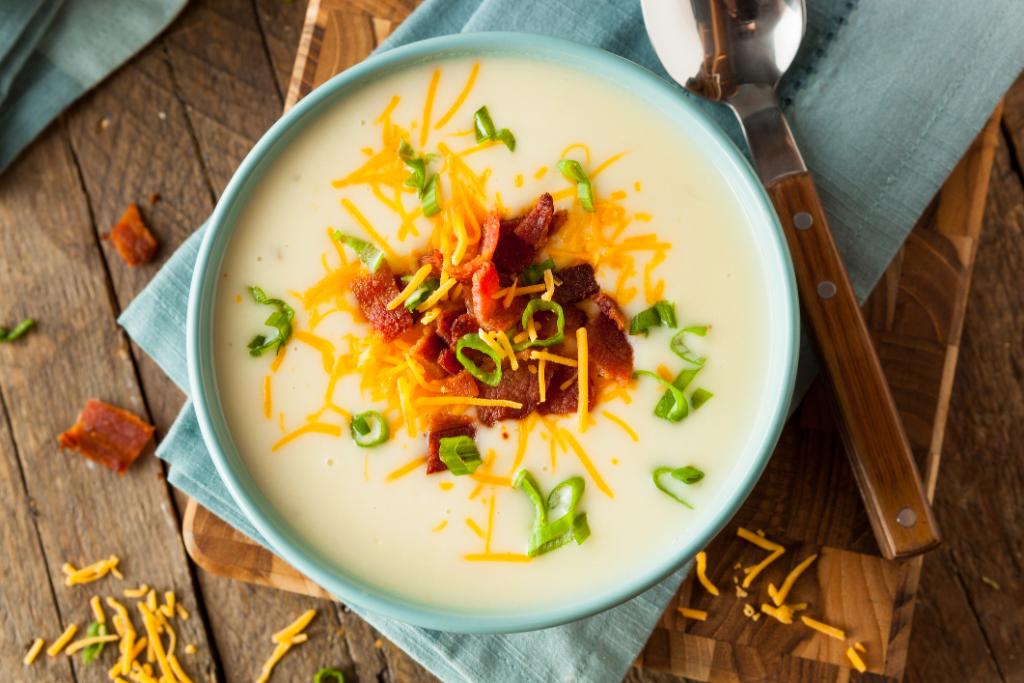 potato soup with cheese and bacon garnish