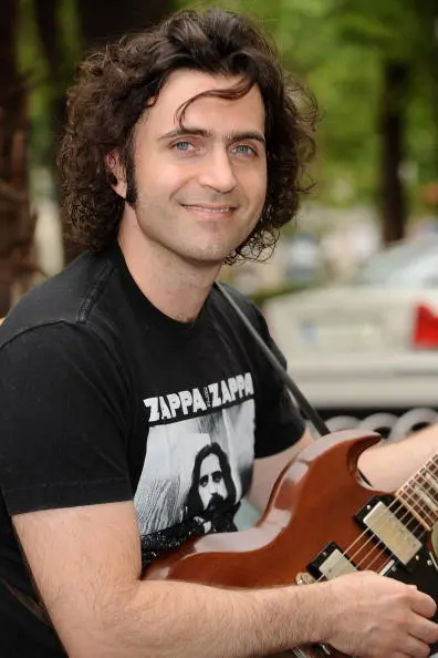 Guitarist Dweezil Zappa poses before a press conference