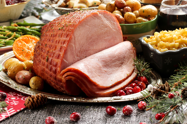 Smoked ham is displayed for sale in a grocery store ahead of the Thanksgiving holiday