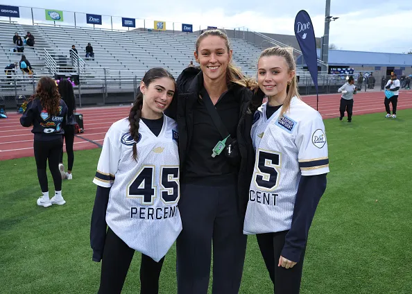 Laila Young, Kylie Kelce, and Summer Young attend the Dove and GENYOUth Star Studded "45 Yard Line" flag football Game
