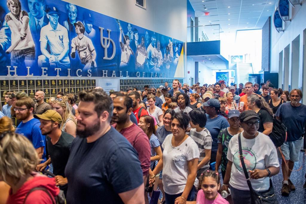 Photo shows the large crowd waiting to get into the Mega Adoption Event last year. Lots of people standing in line waiting to bring home their new furry family members. 